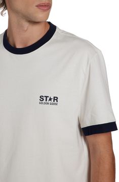 The Italian label's signature broken-star logo winks at the chest of this vintage-inspired ringer T-shirt cut from comfortable cotton. Crewneck Short sleeves 100% cotton Machine wash, dry flat Made in Italy Designer Clothing Cotton Crew Neck Top With Star Patch, Retro Cotton Crew Neck T-shirt, Cotton Crew Neck T-shirt With Star Patch, Cotton T-shirt With Star Patch, Cotton T-shirt With Star Patch And Short Sleeves, Graphic Tee Cotton T-shirt With Star Patch, Cotton Graphic Tee With Star Patch, White Cotton Top With Star Patch, White Cotton Tops With Star Patch