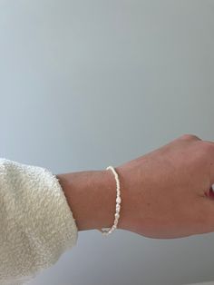 Dainty Hand-strung Stretch Bracelet For Everyday, Dainty Gold Beaded Bracelets, Tarnish Resistant, Minimalist Hand-strung 14k Gold Filled Beaded Bracelets, Dainty Adjustable Gold-plated Beaded Bracelets, Dainty 14k Gold-filled Stretch Bracelet, Small Beaded Bracelet, Small Bead Bracelet, Gold Beaded Bracelet, Seed Bead Bracelet