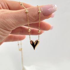 "⭐️ Chic Style Hot Selling gold plated stainless steel adjustable bead cable chain heart pendant necklace. Fashion cute 18K gold plated heart pendant necklace ⭐️ ♥ Material Type: Stainless Steel ♥ Chain Type: Link Ball Chain ♥ Length: 15.5\"+2.5\" extension ♥ Occasion: Other, Anniversary, Engagement, Gift, Wedding, Party ♥ Style: trendy" Minimalist Gold Necklace With Heart Beads, Adjustable Gold Plated Necklaces With Heart Charm, Adjustable Yellow Gold Necklace With Heart Charm, Heart-shaped Chain Necklace With Adjustable Chain For Mother's Day, Adjustable Gold Plated Heart Necklace, Adjustable Gold Plated Heart Pendant Necklace, Adjustable Gold-plated Heart Pendant Necklace, Adjustable Heart-shaped Gold-plated Necklace, Adjustable Gold-plated Heart Necklace