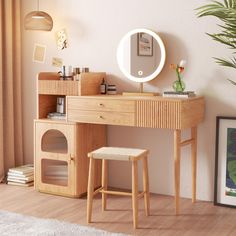 a wooden desk with a mirror and stool in front of it on a white rug