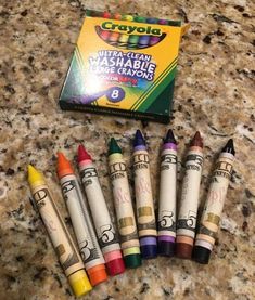 the crayons are lined up on the counter