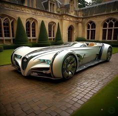 a futuristic car parked in front of a large building