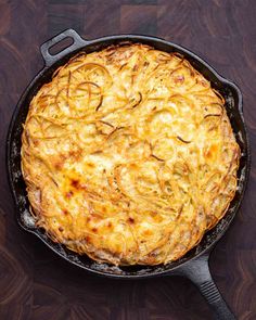 a cheesy dish in a cast iron skillet