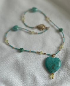 Shades of blue and gold colored beaded necklace with heart pendant Crystal Beaded Necklace, Necklace With Heart, Crystal Bead Necklace, Turquoise Heart, Blue And Gold, Chain Styles, Glasgow, Shades Of Blue, Heart Pendant