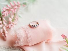 Sterling Silver baby ring featuring twisted band with pink and clear CZ stones. This is a beautiful way to celebrate the birth of a new baby or wonderful birthday gifts too! Ring comes in a beautiful black velvet heart-shaped box. Available in sizes 1-4 Ring Sizing: https://cherishedmomentsshop.com/pages/sizing-charts Fine Jewelry Rings With Side Stones As Gift, Pink Birthstone Ring For Birthday, Pink Jewelry For Birthday Gift On Mother's Day, Pink Sterling Silver Promise Ring, Personalized Pink Ring For Birthday, Pink Jewelry For Birthday And Mother's Day, Pink Sterling Silver Wedding Jewelry With Accent Stones, Personalized Pink Birthday Ring, Gift Cubic Zirconia Ring With Side Stones