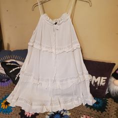 Size Small Never Worn, Perfect Condition Tiered Tank Dress With Crochet Accents And Ruffles, Fully Lined On The Inside. P2p 16" From Top Of Strap To Hem Is 31" Daytime Sleeveless Mini Dress With Lace Trim, White Flowy Tiered Dress For Summer, White Flowy Tiered Dress For Vacation, Flowy White Tiered Dress For Vacation, White Flowy Tiered Summer Dress, White Summer Tiered Dress, White Summer Tiered Beach Dress, White Tiered Summer Beach Dress, White Tiered Dress For Summer Vacation