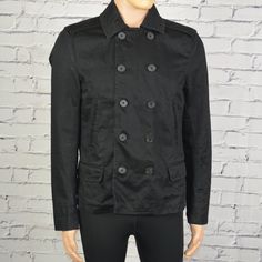 The Jacket Is Black In Color. Double Layer Neckline. Button Down Style. Size Medium. No Holes/Tears. No Stains. No Fabric Pilling. 2 Side Pockets. Thick Style. Extremely Stylish Design. Excellent Condition. Clothing Item Will Be Steam Iron Before Shipping. See Pics For Details. Measurements= All Approximate, Not Perfect. Chest (Armpit To Armpit)= 20.5 Shoulder (Shoulder Seam To Shoulder Seam)= 18 Sleeve (Shoulder Seam To End Of Sleeve)= 26 Back Length (Back Neck Seam To Bottom)= 25 Casual Double-breasted Peacoat With Buttons, Black Button-up Outerwear With Double Button Closure, Black Double-breasted Outerwear With Snap Buttons, Black Collared Blazer With Double Button Closure, Black Pea Coat With Button Cuffs And Lapel Collar, Military Style Outerwear With Snap Buttons For Work, Casual Black Double-breasted Peacoat, Black Double-breasted Outerwear With Button Cuffs, Military Double-breasted Pea Coat With Double Button Closure