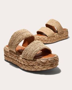 Made in Morocco from natural raffia, the Arlene II sandal features two bands across the forefoot for an easy-on fit. Crafted from durable rubber, the platform sole is detailed with braided trim that pairs seamlessly with the woven upper. Slip-on Woven straps Braided platform Upper: 100% raffia Lining: 100% goat leather Outsole: 100% elastomer Clean with soft brush Made in Morocco Size & Fit Platform height: 2.25in Fits true to size | Clergerie Women's Arlene II Raffia Platform Slide in Natural Size 5.5 | Leather/Rubber Cropped Polo, Woven Raffia, Platform Slides, Crochet Blouse, Vacation Style, Goat Leather, Helly Hansen, Platform Shoes, Hand Crochet