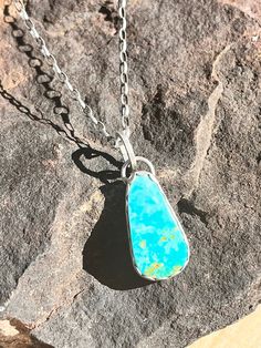 This beautiful bright, clear blue turquoise stone is set in fine silver and the chain is sterling silver. It closes with a handmade clasp.   Looks great layered with longer necklaces.  You'll want to wear it every day! Unique Turquoise Sterling Silver Necklace, Unique Turquoise Jewelry For Everyday, Artisan Sterling Silver Turquoise Necklace Nickel Free, Handmade Turquoise Sterling Silver Necklace, Handmade Sterling Silver Turquoise Necklace, Artisan Sterling Silver Turquoise Necklace, Turquoise Gemstone Necklace In Sterling Silver, Turquoise Necklace With Sterling Silver Clasp As Gift, Handmade Teardrop Turquoise Necklace In Sterling Silver