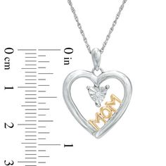 A special gift for mom, this sweet mother's pendant honors everything she means to you. Crafted in sterling silver, this charming open heart is centered with a single shimmering diamond accent. The word "Mom" is sculpted in 14K gold plate along the inside edge, completing the design. Polished to a bright shine, this sleek style suspends along an 18.0-inch rope chain that secures with a spring-ring clasp. Mother's Day Anniversary Jewelry With Diamond Accents, Diamond Accented Jewelry For Anniversary On Mother's Day, White Engraved Heart Necklace For Mother's Day, Mother's Day Anniversary Jewelry With Hallmarks, Engraved White Heart Necklace For Mother's Day, Mother's Day White Sterling Silver Heart Necklace, Heart Necklace With Hallmark For Anniversary And Mother's Day, Mother's Day Jewelry With Diamond Accents, Mother's Day White Jewelry With Diamond Accents