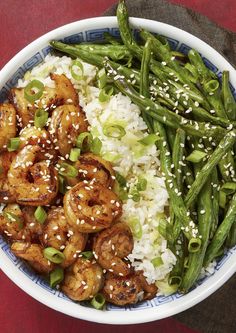 a bowl filled with rice, green beans and shrimp