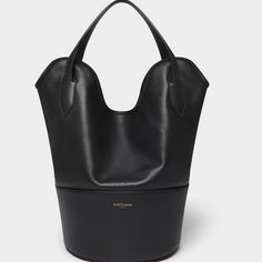 Returns Taking Its Name From The Stingray, Whose Shape It Mimics, The Small Ray Bucket Bag In Black Is A Bucket Bag Made From Two Types Of Leather; The Bottom Is Made From Small Grain And Is Lined With Suede Which Is Both Durable And Provides Texture, And The Upper Area Is Made From Unlined Smooth Calf With A Suede Finish, Allowing The Bag To Be Folded And Carried Under The Arm, Clutch Style. Smaller Than Our Iconic Ray Bucket, The Bag Can Accommodate A 13” Laptop As Well As Everyday Essentials. Formal Black Bucket-shape Shoulder Bag, Black Formal Bucket Shape Shoulder Bag, Formal Black Bucket Shape Shoulder Bag, Black Hobo Bag With Removable Pouch Bucket Shape, Designer Black Bucket Bag With Double Handle, Designer Bucket Hobo Bag For Evening, Black Bucket Shoulder Bag With Top Carry Handle, Designer Black Bucket Bag With Top Handle, Designer Evening Bucket Hobo Bag