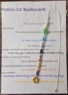 the bookmark has been placed on top of a piece of paper with words written in it