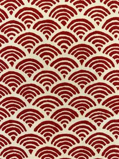 a red and white pattern on fabric