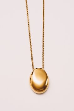 This minimal necklace has a mirrored finish with a high polish shine to add subtle sophistication to any look. Dimensions: Hangs 28" including pendant (1.25") (32mm) Materials: Stainless Steel, 18k Gold plating Ships in a branded jewelry pouch and box, perfect for gift giving! Modern Gold Plated Oval Pendant Necklace, Everyday Polished Yellow Gold Necklace, Everyday Yellow Gold Necklace With Polished Finish, Modern Gold Chain Necklace With Polished Finish, Everyday Jewelry With Polished Oval Pendant, Minimalist Polished Teardrop Pendant Necklace, Minimalist Teardrop Pendant Necklace With Polished Finish, Everyday Oval Pendant Jewelry With Polished Finish, Minimalist Polished Finish Teardrop Pendant Necklace