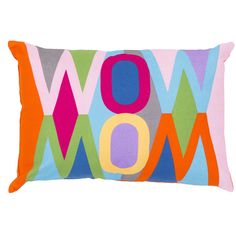 a colorful pillow with the word wow on it