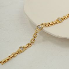 ✦ Adorn your wrist with elegance and sophistication with our 18K gold plated diamond chain bracelet. Crafted in a classic chain style, this bracelet exudes timeless charm and versatility. Featuring sparkling diamonds set in luxurious gold plating, it's the perfect accessory to elevate any outfit with a touch of glamour.----------- DETAILS ------------ Color: Gold - Size (Length): 18.8cm - Materials: Brass, 18K Gold Plated, Cubic Zirconia - SKU: QT2203 Mismatched Earrings Studs, Diamond Chain Bracelet, Crystal Hoop Earrings, Mismatched Earrings, Diamond Chain, Fashion Jewelry Earrings, Gemstone Bracelets, Bridesmaid Jewelry, Black Crystals