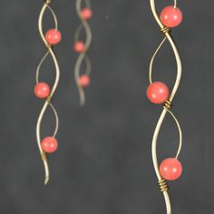 "The wiring earrings are handmade using 14k gold filled wire and pink coral. Free US shipping. Perfect gift for any occasions. Linear long earrings draws attention along vertical lines, visually elongating the face length, increase your height. In art, serpentine line is called\"The Line of Beauty\". S curves modulate from one gradient to another. S curves signify liveliness and activity and excite the attention of the viewer. This design is inspired by Rococo style, which is elegant, playful an Wiring Earrings, Coral Bridesmaid, Copper Pearl, Vertical Lines, Coral Jewelry, Rococo Style, Wire Crafts, Pink Coral, Earrings Long