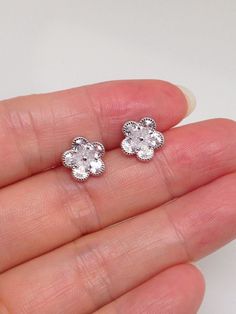 925 Sterling Silver Cz Flower Stud Earrings - Metal: 925 Sterling Silver (Finish: Rhodium Plated) - Stone: Clear Cubic Zirconia, Pear Shaped, Prong - Shape: Flower - Dimension: 9mm(0.35 in), Thickness 1.5mm (Please note that the flower is SMALL.) - Closure: Post at Center, Push Back - Color: Silver Cubic Zirconia Flower Earrings, Sterling Silver Flower Earrings For Anniversary And Mother's Day, Dainty Flower Earrings In Cubic Zirconia, Fine Jewelry Flower Earrings In Cubic Zirconia, Fine Jewelry Flower Earrings With Cubic Zirconia, Dainty Flower Earrings With Cubic Zirconia, Fine Jewelry Flower-shaped Cubic Zirconia Earrings, Flower-shaped Cubic Zirconia Earrings, Silver Cubic Zirconia Flower Earrings