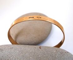 Our bronze tally mark bracelet is hand forged from rich jewelers bronze. Bronze is the metal associated with the 8th and 19th wedding anniversary. Cuffs are hammered and hand stamped with 8 or 19 tally marks representing each one of your  years together. Your initials can be stamped inside for no additional charge. Just leave us a note at checkout if you would like this customization.Our current processing time is 5-7 business days. This is the amount of time it takes to create your piece before Gold Hand Forged Bracelets For Anniversary, Gold Hammered Cuff Bracelet For Anniversary, Adjustable Brass Bracelets For Anniversary, Gold Hand Stamped Wedding Bracelets, Bronze Stamped Jewelry For Anniversary, Gold Stamped Cuff Bracelet For Anniversary, Gold Hand Stamped Bracelets For Anniversary, Hand Stamped Gold Bracelets For Anniversary, 19th Anniversary Gifts