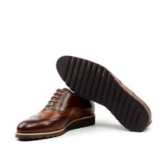 Also known as a wingtip, the Full Brogue is easily identifiable as one of the most classic pairs of men's dress shoes on the market. Featuring a brogue pattern along the sides as well as the toe cap, every man needs a Full Brogue in his shoe closet. Sole units (different available) are Blake stitched to uppers. Upper Materials: Chestnut Brown Box Calf Lining: Caramel Brown Calf Leather Sole: Brown Heeled Rubber Sole Last: Zurigo - Rounded Toe for Traditional English Look YOUR Package Includes Le Masculine Wingtip Lace-up Business Shoes, Brown Goodyear Welted Oxford Lace-up Shoes, Brown Lace-up Brogue Shoes With Cap Toe, Brown Wingtip Leather Derby Shoes, Brown Goodyear Welted Cap Toe Lace-up Shoes, Brown Cap Toe Goodyear Welted Lace-up Shoes, Brown Leather Oxford Shoes With Rubber Heel Cap, Brown Oxford Leather Shoes With Rubber Heel Cap, Brown Cap Toe Lace-up Shoes With Goodyear Welt