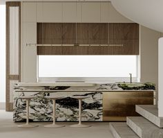 an elegant kitchen with marble counter tops and gold accents