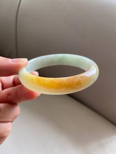 "🌈 Jade Bangle 58.0mm (2.28\"), Round Shape, Light Green & Yellow Brown 🌷 Untreated Natural Jadeite/ Grade A Jade 🌷 Certified : Yes 🌷 Jade from Burma/ Myanmar 🌷 Shape : Round 🌷 Inner diameter : 58.0mm/ 2.28\" 🌷 Width & Thickness : 12.8 x 7.2mm 🌷 Color : Light Green & Yellow Brown 🌷 Free standard shipping from Hong Kong with tracking included 🌷 Take approximately 7-21 days to arrive worldwide" Yellow Jade Round Jewelry, Yellow Round Jade Jewelry, Round Yellow Jade Jewelry, Burma Myanmar, Lavender Green, Jade Bangle, Gemstones Jewelry, Peach Rings, Burmese