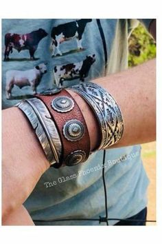 Leather snap bracelet with Aztec conchos. Perfect for stacking with silver and goes with every outfit. Great staple piece! Adjustable Concho Cuff Bracelet Gift, Western Style Leather Bracelet With Concho, Western Style Leather Bracelet With Concho As Gift, Western Style Leather Concho Bracelet As Gift, Vintage Concho Leather Bracelet For Festival, Vintage Leather Concho Bracelet For Festival, Vintage Adjustable Stackable Cuff Bracelet, Western Concho Bracelets For Festival, Western Style Concho Bracelets For Festivals