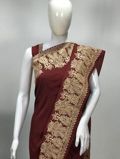 A Marvellous Embroidered Kashmiri Saree which you can wear at any party or a wedding.- - - - - - - - - - - - - - - - - - - - - - - - - - - - - - - - - - - - - - - - Product Details- Condition: Brand New (made to order)- Style: Women Saree Dress- Embroidery: Kashmiri Zari Embroidery- Base Colour: Maroon- Embroidery Colour: Gold- Care Instructions: Dry Clean OnlyF A B R I CSaree: Pure SilkBlouse: Pure SilkF I N I S H- UnstitchedYou can get it stitched locally.- StitchedWant your blouse ready to we Brocade Pre-draped Saree With Resham Embroidery, Traditional Embroidered Raw Silk Pre-draped Saree, Embroidered Chanderi Pre-draped Saree For Puja, Embroidered Silk Pre-draped Saree For Puja, Semi-stitched Brocade Pre-draped Saree With Zari Work, Traditional Embroidered Pre-draped Saree For Festive Occasions, Pre-draped Saree With Embroidered Border For Eid Puja, Red Anarkali Pre-draped Saree With Embroidered Border, Fitted Blouse Piece With Embroidered Border For Puja