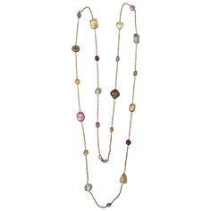 Elegant Multi Stone Semi Precious Necklace set in 14kt yellow gold with 21 multi shaped eye glass set Citrine, Blue Topaz, Amethyst, Lemon Citrine, Smoky Topaz, and Garnet. The stones are set approximately one inch apart. The necklaces measures 36" and a is a perfect laying piece worn long or doubled. Please feel free to contact me with any inquiries you may have. Thank you Stone Gold Necklace, Simplistic Jewelry, Stone Jewelry Necklace, Semi Precious Necklace, Vintage Chain Necklace, Jewelry Market, Feminine Necklace, Semiprecious Stone Jewelry, Smoky Topaz