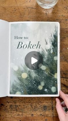 someone is holding an open book with the title how to bokeh on it