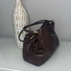 Great Condition. Used Couple Of Times. Genuine Brown Leather. Offers Welcome. Elegant Brown Hobo Bag With Detachable Strap, Elegant Brown Hobo Bag With Removable Pouch, Luxury Coach Hobo Bag For Everyday Use, Modern Coach Satchel With Handle Drop, Elegant Brown Hobo Bag With Handles, Designer Coach Hobo Bag For Everyday, Elegant Hobo Bag With Handles For Travel, Coach Top Handle Hobo Bag For Shopping, Coach Hobo Bag With Removable Pouch And Top Handle