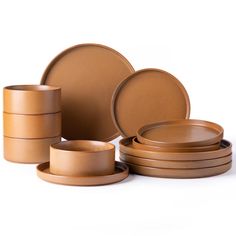 a group of brown dishes sitting on top of each other