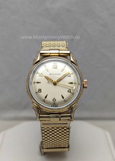 The Facts: Year/Make/Model: 1954 Bulova "Commodore" Reference: 8402283 Case size (excluding crown): 31.5mm Case material: 10k RGP bezel Movement: 17 jewel Bulova 10BUC manual winding Bands: JB Champion adjustable mesh bracelet A vintage 1954 Bulova "Commodore" men's watch, featuring a Swiss-made 17 jewel 10BUC movement that has been inspected, fully serviced, and timegrapher regulated to ensure accuracy.  The lightly polished one piece case (31.5mm excluding the crown) is in very good condition, with light age wear and slight shearing along the rear of the lugs. The dial, as you can see is pristine and the brand new Dutcher Brothers crystal I installed will keep it that way. The gilt hands are absolutely perfect, not one speck of lume is missing, and that's very uncommon today. The crown h Classic Self-winding Watch With Round Dial, Classic Self-winding Watches, Vintage Diamond Analog Watch For Formal Occasions, Yellow Gold Analog Watch For Anniversary, Anniversary Yellow Gold Analog Watch, Retro Gold Watch With Polished Finish, Retro Gold Watches With Polished Finish, Gold Retro Watch With Polished Finish, Vintage Diamond Watch With Subdials For Anniversary