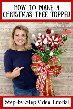 a woman standing next to a christmas tree topper with candy canes on it