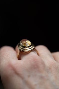 14k gold oval yellow golden citrine ring stamped 585. The bezel has two layered steps and the shank is tapered with a defining line.  6 grams size: 10.25 Stone size: 18mm x 10mm Bezel size: 24mm x 17mm RESIZING AVAILABLE : 👋🏽 I charge an additional $50 if you are interested in having this ring resized. There is a 2 week (or less) turn around time. Please go to this listing https://www.etsy.com/ca/listing/1068711810/ring-sizing-available?ref=shop_home_active_4&frs=1 and add your size to the car Yellow Gold Oval Cabochon Dome Ring For Anniversary, Gold Oval Dome Ring With Gemstone, Gold Dome Ring With Oval Cabochon For Wedding, Antique Oval Dome Ring For Anniversary, Gold Oval Cabochon Dome Ring For Wedding, Heirloom Style Gold Oval Dome Ring, Oval Gemstone Dome Ring In Yellow Gold, Antique Oval Yellow Gold Rings, Oval Gold Topaz Ring Stamped 14k