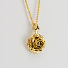 Flower Necklace, Gold Rose Necklace, Confirmation Gift A truly romantic gift! handcrafted solid gold rose necklace. The pendant features a beautiful rose suspended by delicate thorns. * Material: 9ct Fairtrade / recycle UK hallmarked gold * Size of Rose: Approx 1 cm (0.4in) diameter * Length of Chain: 1 mm Spiga chain 40 cm (16in) long (it could be longer on request ) * Ready to Ship in 10 business day * Made in the United Kingdom PACKAGING: Comes uniquely packaged in my Magnolia Restrepo Style Gold Jewelry With Rose Flower Pendant, Gold Necklaces With Rose Flower Pendant, Gold Jewelry With Rose Details As Flower Pendant, Gold Flower Pendant Jewelry With Roses, Gold Necklace With Rose Flower Pendant, Gold Jewelry With Rose Details In Flower Pendant Shape, Elegant Gold Necklaces With Roses, Elegant Gold Necklaces With Rose Details, Rose Flower Pendant Necklace For Wedding