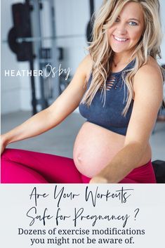 a pregnant woman is sitting on the floor with her hands in her pockets and smiling