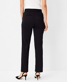 Elevate your wardrobe with the Ann Taylor Petite Pintucked Straight Leg Pant in Double Knit. These pants redefine sophistication with their timeless straight-leg silhouette and classic lean fit, creating a chic, structured look that's perfect for any occasion. The pintucked detailing adds a touch of elegance, making these pants a must-have for the fashion-forward professional.

- Size: Petite 8
- Color: Black
- Material: 78% Polyester, 15% Rayon, 7% Spandex
- Gender: Female
- Fit: Regular fit, l Elegant Stretch Dress Pants Straight Fit, Elegant Stretch Straight Dress Pants, Elegant Straight Stretch Dress Pants, Chic Straight Formal Pants, Elegant Tailored Straight Bottoms, Chic Straight Bottoms For Formal Occasions, Classic Stretch Bottoms With Straight Silhouette, Chic Tailored Straight Bottoms, Chic Tailored Straight Dress Pants