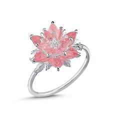 a pink flower ring with white diamonds on the top and bottom, set in silver