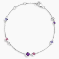 Lilac Bracelet - Silver. Lustrous diamonds, amethysts, tanzanites, and pink spinels glimmer gracefully along the chain of this unique bracelet. The length of the chain can be adjusted to 6, 6.5, or 7 inches to suit individual preference (1/10 total carat weight). Sterling Silver Bracelet With Sparkling Stones, Elegant Pink Chain Bracelet With Adjustable Chain, Elegant Amethyst Bracelets With Gemstone Accents, White Gold Multi-stone Round Bracelet, Luxury Purple Jubilee Bracelet, Adjustable Purple Jewelry With Sparkling Stones, Elegant Amethyst Jewelry With Adjustable Chain, Elegant Purple Gemstone Bracelets, Fine Jewelry Bracelets With Gemstone Accents And Cubic Zirconia