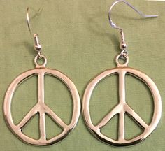 Metal Symbolic Hypoallergenic Earrings, Silver Pewter Earrings As Gift, Silver Peace Sign Jewelry Gift, Silver Pewter Earrings For Gift, Adjustable Sterling Silver Peace Sign Jewelry, Symbolic Round Peace Sign Jewelry, Symbolic Hypoallergenic Metal Jewelry, Symbolic Silver Jewelry With Peace Sign, Vintage Jewelry With Peace Sign As Gift