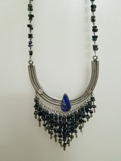 Vintage Peruvian Lapis Silver Bib Style Necklace,, lovely craftsmanship.. each stone is linked with silver wire and a nice Lapis stone inlaid in silver ornate metal is the center pieces.. shorter style necklace.. 15 inches Festival Wire Wrapped Metal Necklaces, Artisan Silver Beaded Necklace Nickel Free, Antique Silver Beaded Bohemian Jewelry, Bohemian Antique Silver Jewelry With Silver Beads, Bohemian Antique Silver Beaded Jewelry, Silver Bohemian Jewelry With Natural Stones, Bohemian Silver Jewelry With Natural Stones, Silver Metal Jewelry With Stones, Vintage Silver Crystal Necklace