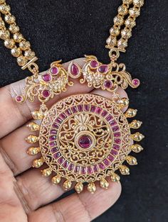 Step into the world of timeless elegance and traditional beauty with this stunning Ruby and gold toned Traditional Indian  Rani Haar necklace set. This long Rani Haar is adorned with intricate Meena Kari work, and it comes with matching earrings for a complete look.  Long Unique Rani Haar Necklace/ Indian Long Necklace / Pakistani Jewelry / Peacock Necklace Mala /Traditional Jewelry/Gold Plated Bridal Necklace PRODUCT VARIATIONS - We strive to present each product with utmost accuracy and detail Gold Jewelry With Intricate Design For Puja, Gold Plated Jewelry With Intricate Design For Puja, Filigree Jewelry For Puja And Festivals, Festive Filigree Jewelry For Puja, Gold Kundan Jewelry Set With Peacock Design, Gold Plated Chandbali Temple Jewelry Sets, Elegant Kundan Necklace With Peacock Design For Puja, Ornate Chandbali Jewelry Sets For Gift, Bollywood Style Temple Necklace With Peacock Design