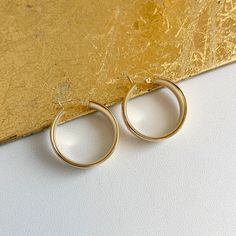 14KT yellow gold shiny + wide round hoop earrings. Yummy, chunky gold hoops in a mid, round size. Length: 25mm Width: 23mm Thickness: 8mm Weight: 3.63 grams Stamped 14K Latch back closure Solid 14K Gold Rounded Earrings For Everyday, Gold Minimalist Round Huggie Earrings, Gold Minimalist Huggie Earrings, Everyday Round Gold Plated Hoop Earrings, Everyday Round Gold-plated Hoop Earrings, Everyday Gold Round Huggie Earrings, Everyday Round Gold Huggie Earrings, Gold Round Huggie Earrings For Everyday, Gold Round Earrings For Everyday