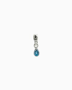 The Teardrop Stone Charm features a faceted pear-shaped blue zircon stone on a petroglyph accented loop. Pair with your favorite hook bracelet or dainty chain, sold separately. Metal: Sterling silver Stone: Blue zircon Dimensions: 16mm x 4mm Stone Size: 6mm x 4mm Style #: C120BZ Sterling Silver Drop Jewelry With Dangling Charms, Sterling Silver Teardrop Charms Jewelry, Blue Teardrop Jewelry For Everyday, Teardrop Sapphire Birthstone Jewelry, Pear Shaped Blue Topaz Jewelry Gift, Pear-shaped Blue Topaz Jewelry As A Gift, Pear-shaped Blue Topaz Jewelry For Gifts, Pear Shaped Blue Topaz Jewelry For Gifts, Everyday Teardrop Charm Jewelry