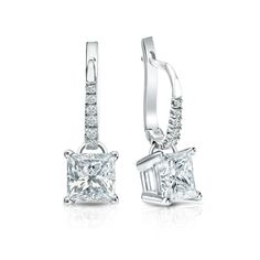 Dangle studs 4-Prong Basket set diamond earrings make a stylish statement in beauty. These 14k white gold diamond earrings sparkle with a 2.00 ct. princess-cut natural diamonds as center stone and 0.10 ct. total weight of small round diamonds as side stone, together with a total weight of 2.10 ct. in lever back clasps. Princess Diamond Earrings, Princess Cut Diamond Earrings, Princess Cut Earrings, Black Diamond Pendant, Beautiful Diamond Earrings, Black Diamond Studs, Halo Diamond Earrings, Earrings White Gold, White Gold Diamond Earrings