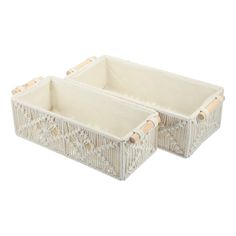 two white wicker baskets with handles on each side, one is empty and the other has