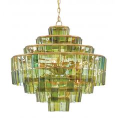 a green chandelier hanging from a gold chain