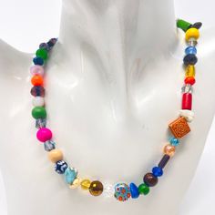 This beautiful colorful beaded necklace is handmade with a variety of gemstones that make this necklace stand out when you are wearing it excellent gift for her, mom, friendship, best friend, teacher, This beautiful necklace comes in different sizes and has a 2-inch extension chain. *Beads may vary slightly ITEM DETAILS Materials: Czech crystal, jade, multicolor quartz, quartzite stone, coral, wood beads Bohemian Rainbow Crystal Necklaces With Colorful Beads, Bohemian Rainbow Crystal Necklace With Colorful Beads, Colorful Bohemian Faceted Beads, Bohemian Multicolor Faceted Beads Crystal Necklaces, Bohemian Multicolor Faceted Beads Crystal Necklace, Handmade Multicolor Crystal Necklace For Festivals, Adjustable Multicolor Crystal Necklaces With Large Beads, Adjustable Multicolor Crystal Necklace With Large Beads, Festival Multicolor Crystal Necklaces With Colorful Beads